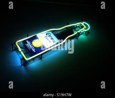Lit neon sign of Corona beer in a bar Stock Photo