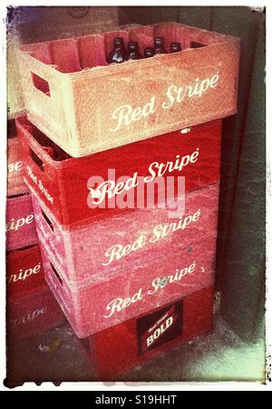 Stacked crates of empty Red Stripe beer bottles Stock Photo