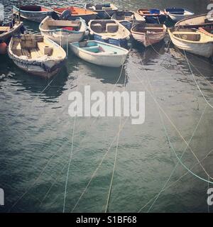 Fishing boats tied up in Mevagissey port, St. Austell in Cornwall Stock Photo