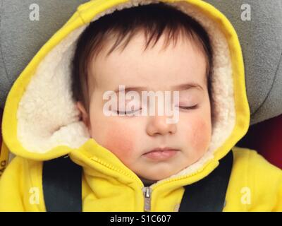 Baby sleeping in the baby car Stock Photo
