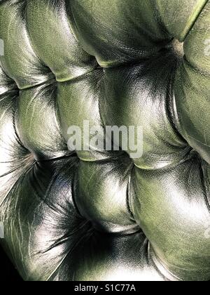 Old green leather couch detail. Stock Photo