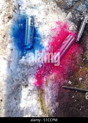 Broken printer ink cartridges in the snow. Stock Photo