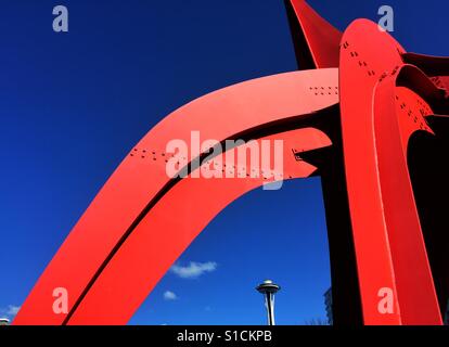 Sunlit Space Needle peaks through The Eagle, massive sculpture by Alexander Calder Stock Photo