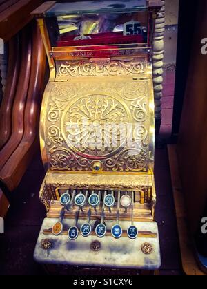 Classic cash register, used extensively until the modern machines came along. Now a museum piece or an item in an antique shop. Stock Photo