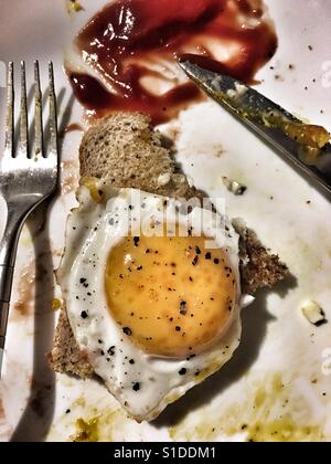 Egg on toast (half eaten) Stock Photo