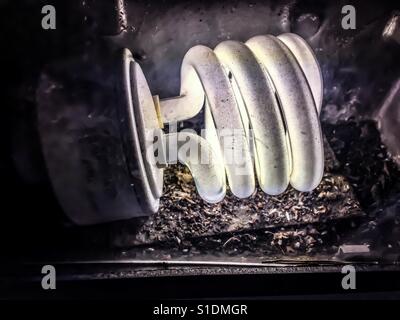 Energy efficient light bulb glowing in light box Stock Photo