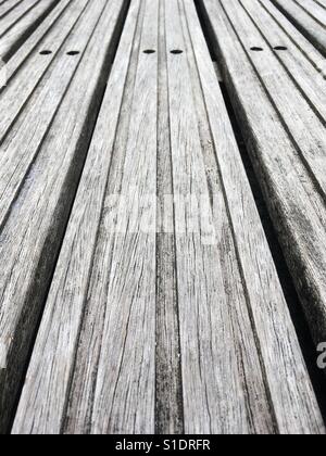 Close up of wooden decking creating an abstract graphic pattern. Stock Photo