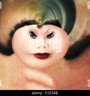 Creepy abstract morphed version of antique doll face. Stock Photo