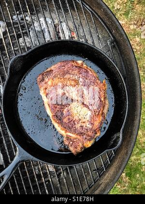 Charcoal grill steak in iron pan Top angle shot Stock Photo Alamy