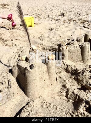 Sand castle on the beach Stock Photo