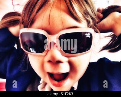 Girl in Sunglasses with pigtails Stock Photo