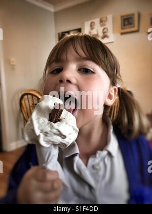 Girl eating ice cream cone Stock Photo