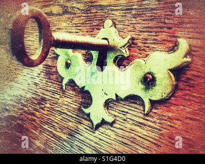 Antique oak bureau under lock and key Stock Photo