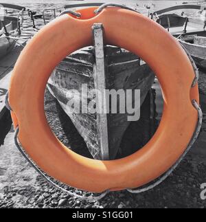 Life ring on wooden boat Stock Photo