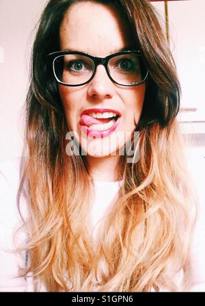 Crazy girl with glasses and red lips Stock Photo