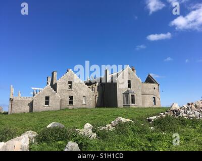 Vallay House on Vallay Island in North Uist which has been allowed to degrade gracefully. Built in 1902, pictured in June 2017 Stock Photo