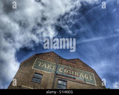 Take Courage Advert on What used to be The Courage & Co. Ltd Brewery Stock Photo