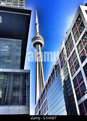 The CN Tower between two buildings Stock Photo - Alamy