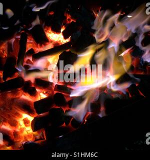Flames from burning charcoal Stock Photo