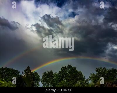 Double rainbow in the city Stock Photo