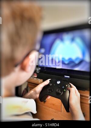 Boy playing Xbox Stock Photo