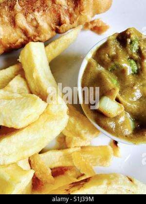 Fish, chips and curry sauce Stock Photo