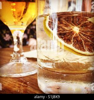 Happy hour drink with lemon slice. Stock Photo