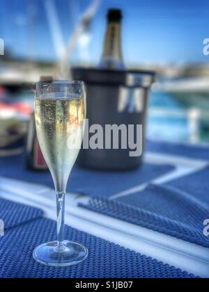Glass of champagne on deck Stock Photo