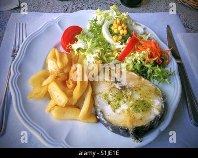 Hake with vegetables. Stock Photo