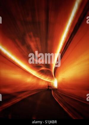 Fast moving drive through a mountain tunnel. Trans Canada Highway 1, Fraser Canyon section, British Columbia, Canada. Stock Photo