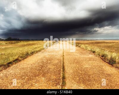 Wartime concrete road, Shingle Street, Suffolk, England. Stock Photo