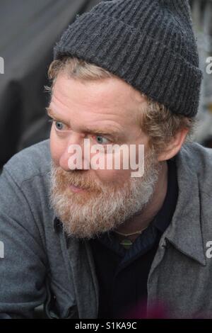 Irish singer Glen Hansard listens to accolades from a fans after he performed at 'The Hardly Strictly Bluegrass' Festival, Oct.1, 2016, San Francisco. Stock Photo