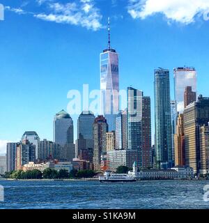 New York skyline including One World Trade Center and ferry
