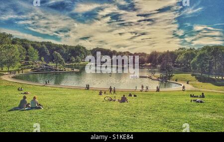 People relaxing around Beaver Lake, Mount Royal, Montreal, Quebec in the summertime. Stock Photo
