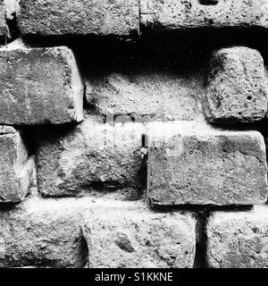 Brick wall with missing bricks Stock Photo