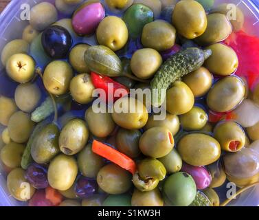 Mixed olives, gherkins, etc, for sale on a Spanish market stall Stock Photo