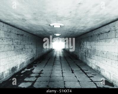 Eerie pedestrian tunnel in black and white Stock Photo