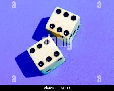 Two lucky six dice / 2 die showing a high score of 6 each, for a throw of good fortune in a game of chance or gambling, gamble Stock Photo