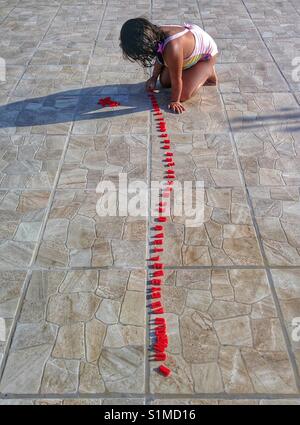 Little girl playing with letters. Stock Photo