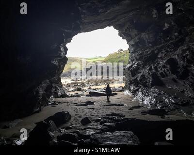 Cave hunting in cornwall Stock Photo