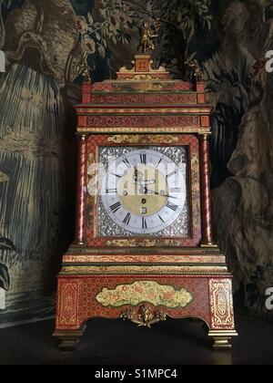 Antique clock at Lyme Hall, Lyme Park, Disley, Cheshire UK Stock Photo