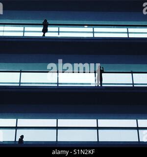 Abstract silhouettes in office balconies Stock Photo