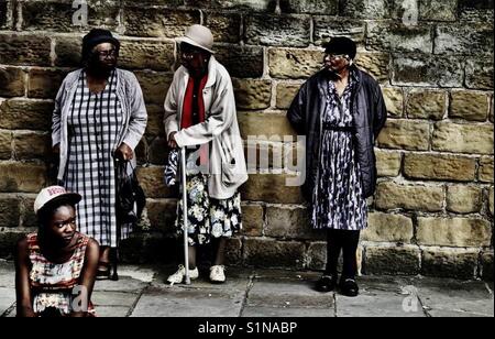 Women waiting for the carnival on Chapeltown Road, Leeds Stock Photo