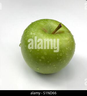Apple with droplets of water on a white background Stock Photo