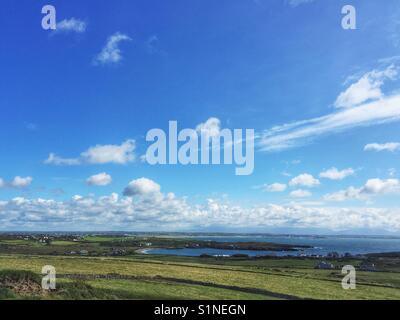 View from Rhoscolyn head, North Wales, looking towards Cymyran Bay and Rhosneigr, Anglesey Stock Photo