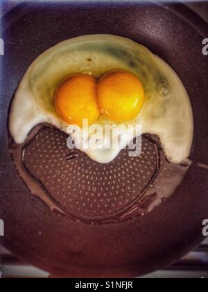 Double yolk egg frying Stock Photo