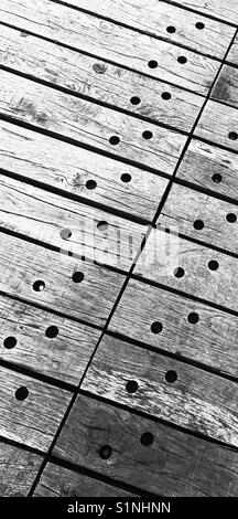 Hi contrast black and white image of pattern formed by wooden planks used for flooring Stock Photo