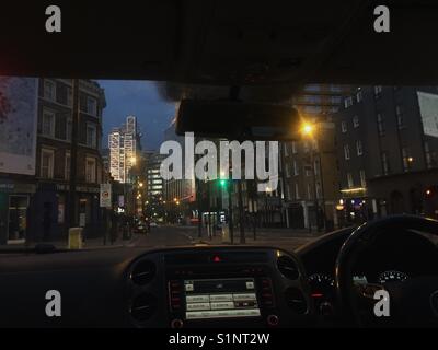 Taxi ride at dawn through the City of London. Stock Photo