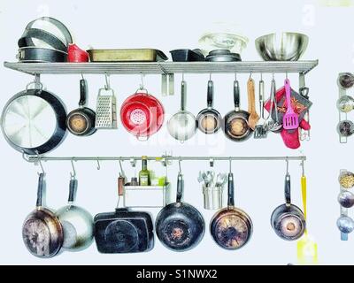 Kitchen utensils on a rack Stock Photo