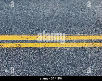 Yellow lines on a road in New Jersey, USA. Stock Photo